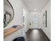 Bright hallway features modern art, wood floors, and leads to the front door at 5634 Clearwater Ct, Lakewood Ranch, FL 34211