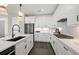 Well-equipped kitchen with white cabinets, a center island, stainless steel appliances, and stylish countertops at 5634 Clearwater Ct, Lakewood Ranch, FL 34211