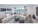 Bright and airy living room featuring plush sectional sofa, stylish accents, and scenic water views at 5634 Clearwater Ct, Lakewood Ranch, FL 34211