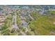 An aerial view showing community amenities, including a pool and tennis courts at 6229 Bayside Key Dr, Tampa, FL 33615
