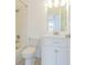 Bright bathroom featuring white tiled shower, tub, and vanity with a large mirror and ample lighting at 6229 Bayside Key Dr, Tampa, FL 33615
