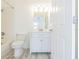 Bright bathroom featuring a new vanity, toilet, and a shower and tub combo at 6229 Bayside Key Dr, Tampa, FL 33615