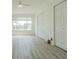Well-lit bedroom features two large closets, wood floors, and a large window at 6229 Bayside Key Dr, Tampa, FL 33615