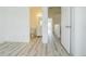 Spacious bedroom featuring neutral walls with tile flooring and adjacent view of an on-suite bathroom at 6229 Bayside Key Dr, Tampa, FL 33615