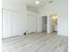 Spacious and well-lit bedroom with neutral-painted walls, tile floors, and on-suite bathroom at 6229 Bayside Key Dr, Tampa, FL 33615