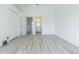 Empty bedroom featuring neutral-painted walls, tile floors, and an on-suite bathroom at 6229 Bayside Key Dr, Tampa, FL 33615