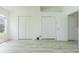 Large empty bedroom with neutral-painted walls, tile floors, and great closet space at 6229 Bayside Key Dr, Tampa, FL 33615