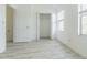 Bedroom with wood-look flooring, closet, and natural light from the window at 6229 Bayside Key Dr, Tampa, FL 33615