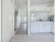 Open kitchen with white appliances and tile flooring at 6229 Bayside Key Dr, Tampa, FL 33615