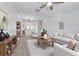 Bright living room with white walls, wood-style flooring, and stylish furnishings for a welcoming atmosphere at 6229 Bayside Key Dr, Tampa, FL 33615