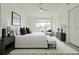 Bright main bedroom featuring a window with a great view and well-decorated furniture at 6229 Bayside Key Dr, Tampa, FL 33615