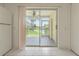 Back patio with beautiful views of the manicured grounds at 6229 Bayside Key Dr, Tampa, FL 33615