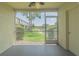 A screened-in patio overlooking a grassy lawn at 6229 Bayside Key Dr, Tampa, FL 33615