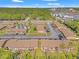 Aerial view of a community with a pool, ample parking, and well-maintained lawns at 7124 Barclay Ave # A, Spring Hill, FL 34609