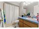 Bathroom featuring a shower with white curtain and a single sink vanity at 7124 Barclay Ave # A, Spring Hill, FL 34609