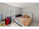 Bedroom with a window, neutral walls, and tile flooring at 7124 Barclay Ave # A, Spring Hill, FL 34609