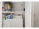 Practical laundry room with washer, dryer, and storage solutions for easy chore management at 7124 Barclay Ave # A, Spring Hill, FL 34609