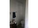 Compact bathroom features a toilet, towel rack, and small storage cabinet at 7187 53Rd N St, Pinellas Park, FL 33781