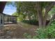Lush backyard with screened patio, offering a private retreat for relaxation and leisure at 8332 Berkeley Manor Blvd, Spring Hill, FL 34606