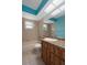 Bathroom featuring a shower-tub combo, neutral tile, a white toilet and a light colored countertop with an oval sink at 8332 Berkeley Manor Blvd, Spring Hill, FL 34606
