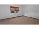 An empty bedroom with tile floors, a window, and white walls at 8332 Berkeley Manor Blvd, Spring Hill, FL 34606