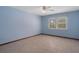 Neutral bedroom with carpet flooring and ample natural light from windows at 8332 Berkeley Manor Blvd, Spring Hill, FL 34606