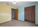 This colorful bedroom features tile floors, ceiling fan, and a closet at 8332 Berkeley Manor Blvd, Spring Hill, FL 34606