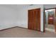 Bedroom featuring neutral tile flooring and a large closet at 8332 Berkeley Manor Blvd, Spring Hill, FL 34606