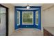 Breakfast nook with a large window, light, ceiling fan, and tile floors at 8332 Berkeley Manor Blvd, Spring Hill, FL 34606