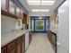 Bright kitchen with granite countertops, wood cabinets, and a bay window eating area at 8332 Berkeley Manor Blvd, Spring Hill, FL 34606