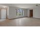 Spacious living room featuring large arched windows and tile flooring at 8332 Berkeley Manor Blvd, Spring Hill, FL 34606