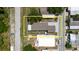 An aerial view of the manufactured home showcasing the roof and yard at 8471 Fantasia Park Way, Riverview, FL 33578
