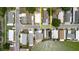 An aerial view showcases a property bordered in yellow, positioned within a community near a picturesque lake at 8471 Fantasia Park Way, Riverview, FL 33578