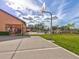 Outdoor basketball court with view of pool and palm trees at 8471 Fantasia Park Way, Riverview, FL 33578