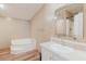 Well-lit bathroom featuring a soaking tub, vanity with mirror, and a shower with neutral tones at 8471 Fantasia Park Way, Riverview, FL 33578