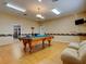 Well-lit billiards room includes a classic pool table for residents at 8471 Fantasia Park Way, Riverview, FL 33578