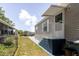Exterior view of the manufactured home and its well-maintained surroundings at 8471 Fantasia Park Way, Riverview, FL 33578