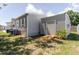 Exterior view of the home and shed with a wooden ramp and well-maintained lawn at 8471 Fantasia Park Way, Riverview, FL 33578
