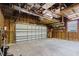 Spacious garage featuring ample storage shelves, a workspace, and a closed overhead door at 8471 Fantasia Park Way, Riverview, FL 33578