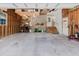 Spacious garage featuring ample storage shelves, a workspace, and stairs to the entry door at 8471 Fantasia Park Way, Riverview, FL 33578