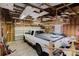 This garage offers ample space for parking, with an open ceiling and storage platform enhancing organization at 8471 Fantasia Park Way, Riverview, FL 33578