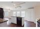 Bright kitchen features white cabinets, black dishwasher, and a center island perfect for food preparation at 8471 Fantasia Park Way, Riverview, FL 33578
