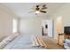 Inviting bedroom featuring plush carpet, neutral walls, and a ceiling fan for optimal comfort and relaxation at 8471 Fantasia Park Way, Riverview, FL 33578
