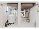 Under-sink plumbing showcasing a filtration system and storage within the cabinet at 8471 Fantasia Park Way, Riverview, FL 33578