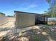 Backyard with a screened-in lanai, a walkway and privacy fence at 8812 Bayaud Dr, Tampa, FL 33626