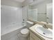 Neutral bathroom features white cabinets, a white countertop, tub and shower combo and a white toilet at 8812 Bayaud Dr, Tampa, FL 33626