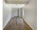 An extra room with laminate floors, overhead lighting and access to the exterior is move-in ready at 8812 Bayaud Dr, Tampa, FL 33626