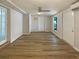Large bonus room features laminate wood floors, neutral paint, windows, and multiple entrances at 8812 Bayaud Dr, Tampa, FL 33626
