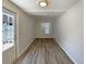 Bonus room with laminate wood floors, overhead lighting and access to the outside area at 8812 Bayaud Dr, Tampa, FL 33626