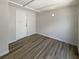 This bonus room features laminate wood floors, overhead lighting and a door to the exterior at 8812 Bayaud Dr, Tampa, FL 33626